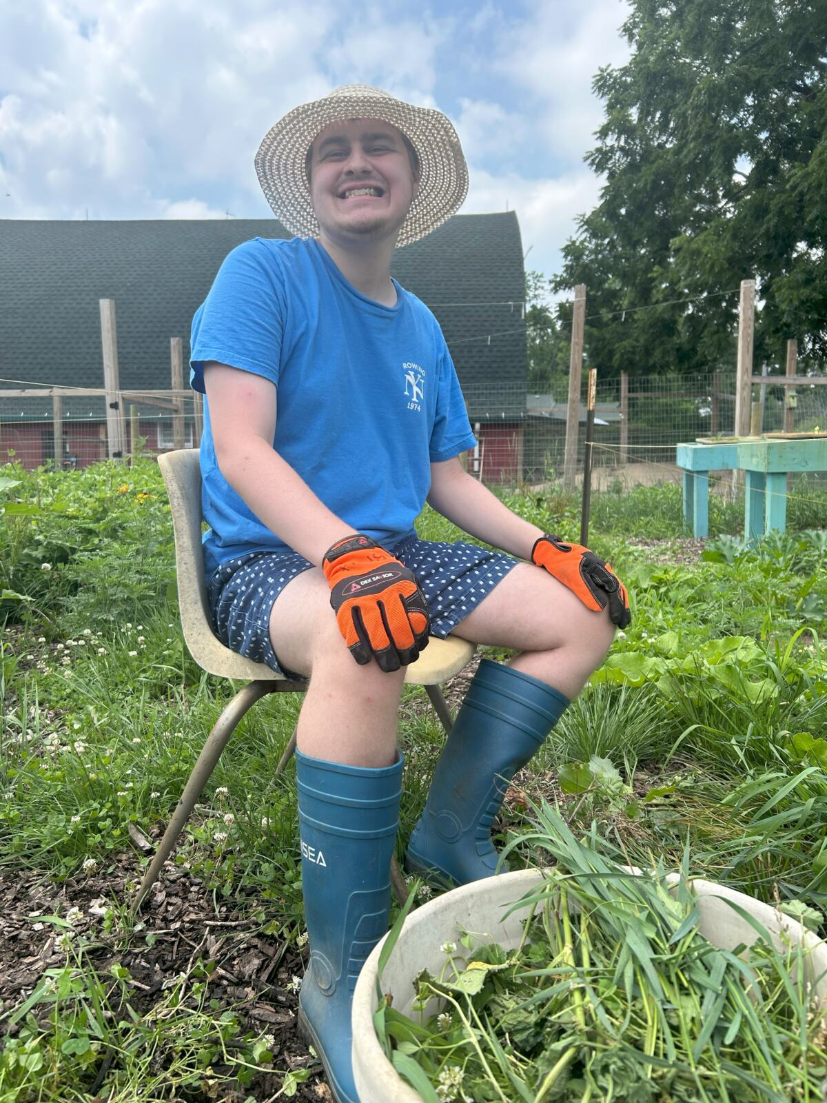 Smiling participant working in garden.
