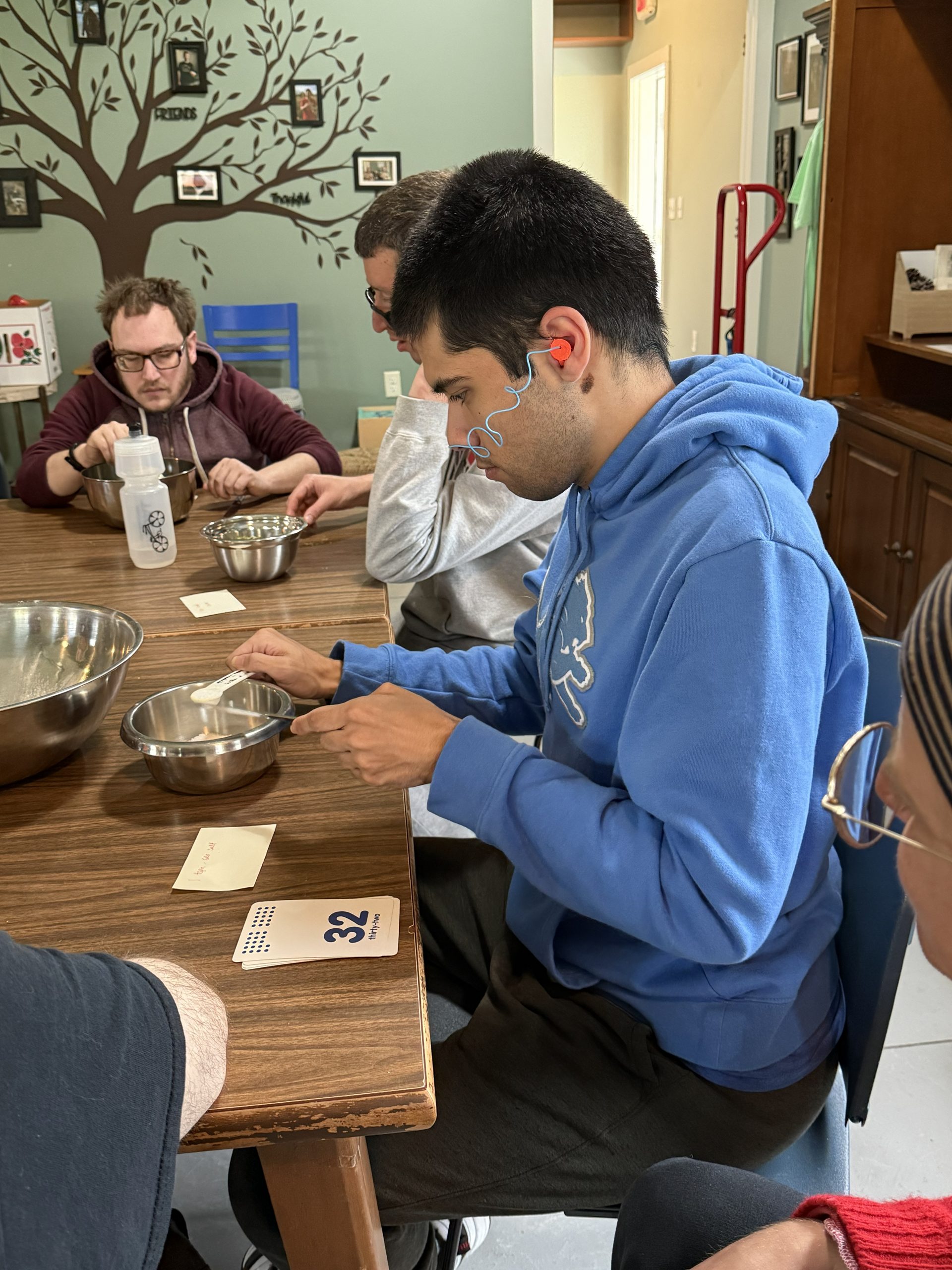 Participants around table making jar mixes.