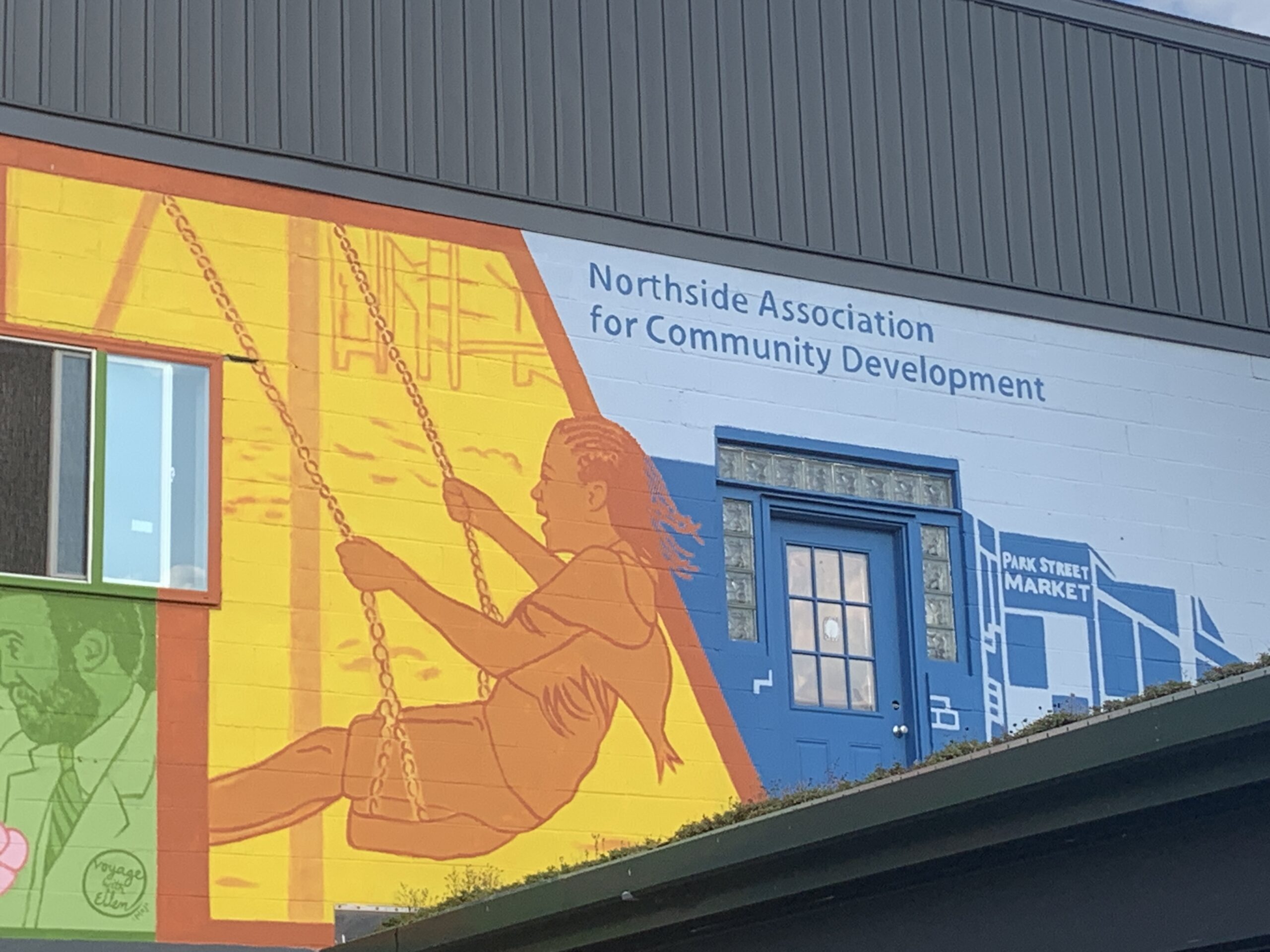 Colorful mural on the Northside Association for Community Development building.